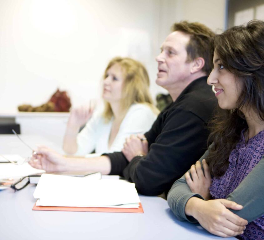 adult students learning in classroom